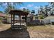 Backyard view of the house with a gazebo at 3005 E Shadowlawn Ave, Tampa, FL 33610