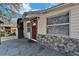 House exterior with red door and stone accents at 3005 E Shadowlawn Ave, Tampa, FL 33610