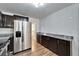 Modern kitchen with granite countertops and stainless steel appliances at 3005 E Shadowlawn Ave, Tampa, FL 33610