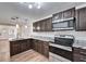 Modern kitchen with granite countertops and stainless steel appliances at 3005 E Shadowlawn Ave, Tampa, FL 33610