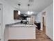Modern kitchen with granite countertops and stainless steel appliances at 3005 E Shadowlawn Ave, Tampa, FL 33610