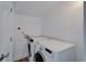 Stackable washer and dryer in a dedicated laundry room at 3005 E Shadowlawn Ave, Tampa, FL 33610