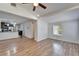 Spacious living room with hardwood floors and kitchen view at 3005 E Shadowlawn Ave, Tampa, FL 33610