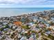 Aerial view showcasing the home's proximity to the ocean and neighborhood at 311 15Th Ave, Indian Rocks Beach, FL 33785