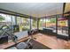 Screened porch with home gym and backyard access at 311 15Th Ave, Indian Rocks Beach, FL 33785