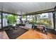 Screened porch with home gym and backyard view at 311 15Th Ave, Indian Rocks Beach, FL 33785