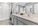 Bathroom with double vanity and walk-in shower at 33166 Osprey Peak Way, San Antonio, FL 33576
