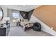 Bedroom with unique wall design, bed, and beanbag chair at 33166 Osprey Peak Way, San Antonio, FL 33576