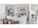 Modern kitchen with island, stainless steel appliances, and gray cabinets at 33166 Osprey Peak Way, San Antonio, FL 33576