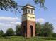 Seven Oaks community clock tower, a brick structure with a clock and windows at 3647 Fawnmist Dr Dr, Wesley Chapel, FL 33544