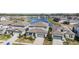 Aerial view of homes surrounding a pond with a fountain at 3888 Almond Brook Blvd, Land O Lakes, FL 34638