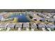 An aerial shot of a residential community showcasing the pool, amenity center, and a scenic pond at 3888 Almond Brook Blvd, Land O Lakes, FL 34638