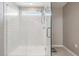 Bathroom featuring a glass enclosed shower with a window for natural light at 3888 Almond Brook Blvd, Land O Lakes, FL 34638