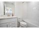 Well-lit bathroom showcasing a vanity, subway tile surround, and a combo tub-shower at 3888 Almond Brook Blvd, Land O Lakes, FL 34638
