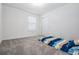Neutral bedroom featuring plush carpeting, a closet, and a bright window at 3888 Almond Brook Blvd, Land O Lakes, FL 34638