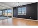 Dining area features a modern chandelier, accent wall, and sliding glass door at 3888 Almond Brook Blvd, Land O Lakes, FL 34638