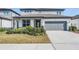Beautiful two-story home featuring well-maintained landscaping, offering curb appeal and a welcoming ambiance at 3888 Almond Brook Blvd, Land O Lakes, FL 34638