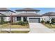 Attractive two-story home with a well-kept lawn and convenient two-car garage, ideal for suburban living at 3888 Almond Brook Blvd, Land O Lakes, FL 34638