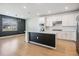 Modern kitchen with stainless steel appliances, center island, and wood floors at 3888 Almond Brook Blvd, Land O Lakes, FL 34638