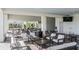 Outdoor covered patio features ample seating and tables at 3888 Almond Brook Blvd, Land O Lakes, FL 34638