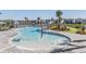 Community pool with zero entry, splash pad, fountain, and lounge seating at 3888 Almond Brook Blvd, Land O Lakes, FL 34638