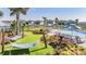 Relaxing community pool area with hammocks, lounge chairs, and lush landscaping for the perfect outdoor escape at 3888 Almond Brook Blvd, Land O Lakes, FL 34638