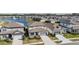 Street view of multiple grey and white homes with manicured lawns in a residential neighborhood at 3888 Almond Brook Blvd, Land O Lakes, FL 34638