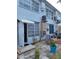The building exterior shows an open door, small patio and multiple windows letting in ample natural light at 4140 55Th N St # 1115, Kenneth City, FL 33709