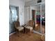 Cozy sun room featuring wicker chairs, mirror doors, and natural lighting at 4140 55Th N St # 1115, Kenneth City, FL 33709
