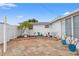 Landscaped backyard with stonework and various plants at 5152 Victoria Ln, Holiday, FL 34690