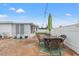 Patio with dining table and chairs, near the house at 5152 Victoria Ln, Holiday, FL 34690