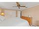 King-size bed, large closet, and ceiling fan in spacious bedroom at 5152 Victoria Ln, Holiday, FL 34690