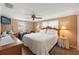 Large bedroom with king-size bed, wood dresser, and ceiling fan at 5152 Victoria Ln, Holiday, FL 34690