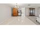 Dining room with tile floor, chandelier, and wooden cabinet at 5152 Victoria Ln, Holiday, FL 34690