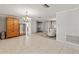Bright dining room with tile floors and chandelier, open to kitchen at 5152 Victoria Ln, Holiday, FL 34690