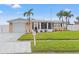Single-story house with a well-maintained lawn and attached garage at 5152 Victoria Ln, Holiday, FL 34690