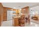 Spacious kitchen with wood cabinets and granite island at 5152 Victoria Ln, Holiday, FL 34690
