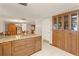 Kitchen features granite counters, wood cabinets, and island at 5152 Victoria Ln, Holiday, FL 34690