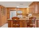 Kitchen with granite countertops and wood cabinets at 5152 Victoria Ln, Holiday, FL 34690