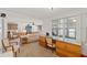 Open living room with built-in shelving and a view into the kitchen at 5152 Victoria Ln, Holiday, FL 34690