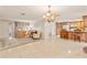 Living room with tiled floors and view of kitchen at 5152 Victoria Ln, Holiday, FL 34690