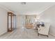 Spacious living room with tiled floors, neutral walls, and vintage furniture at 5152 Victoria Ln, Holiday, FL 34690