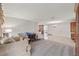 Spacious living room with tiled floors, neutral walls, and vintage furniture at 5152 Victoria Ln, Holiday, FL 34690