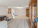 Spacious living room with tiled floors, neutral walls, and vintage furniture at 5152 Victoria Ln, Holiday, FL 34690