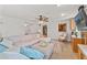 Living room with sectional sofa, built-ins, and view to kitchen at 5152 Victoria Ln, Holiday, FL 34690