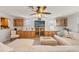 Relaxing living room, featuring a sectional sofa and built-in entertainment center at 5152 Victoria Ln, Holiday, FL 34690