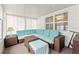 Bright sunroom features a large sectional and plenty of natural light at 5152 Victoria Ln, Holiday, FL 34690