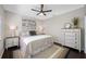 Bedroom with lamps on each bedside table, a dresser, and ceiling fan at 5501 E Longboat Blvd, Tampa, FL 33615
