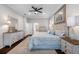 Spacious Primary bedroom with slider door access to the screened-in porch and ensuite bathroom at 5501 E Longboat Blvd, Tampa, FL 33615