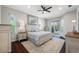 Primary bedroom featuring a ceiling fan, slider door access to the lanai, and light color palette at 5501 E Longboat Blvd, Tampa, FL 33615
